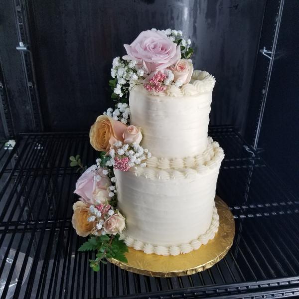 wedding cake with pink flowers